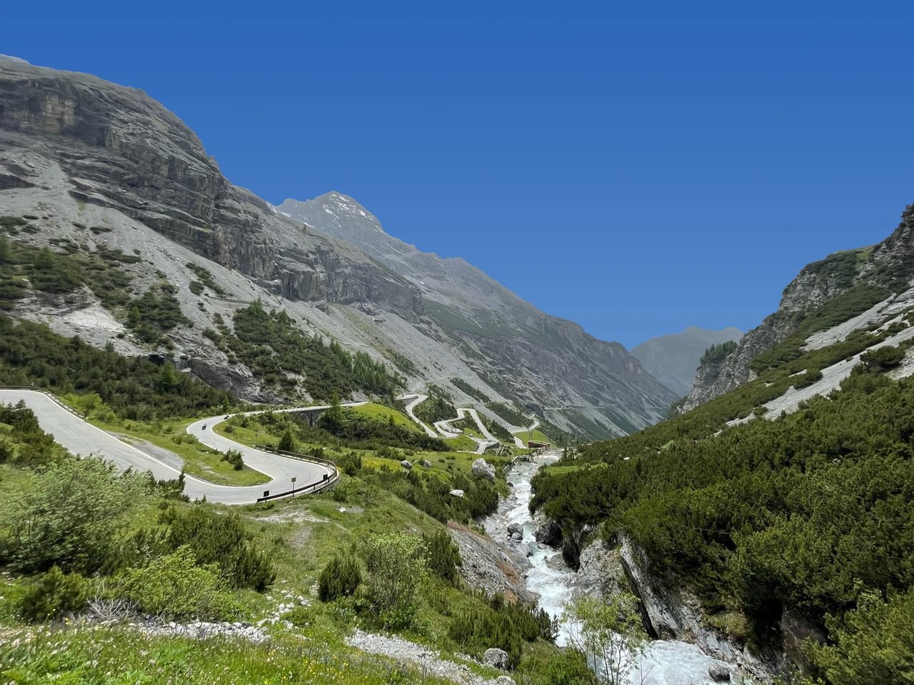 An alpine pass road winding through the mountains - a Pass Pursuits European driving route